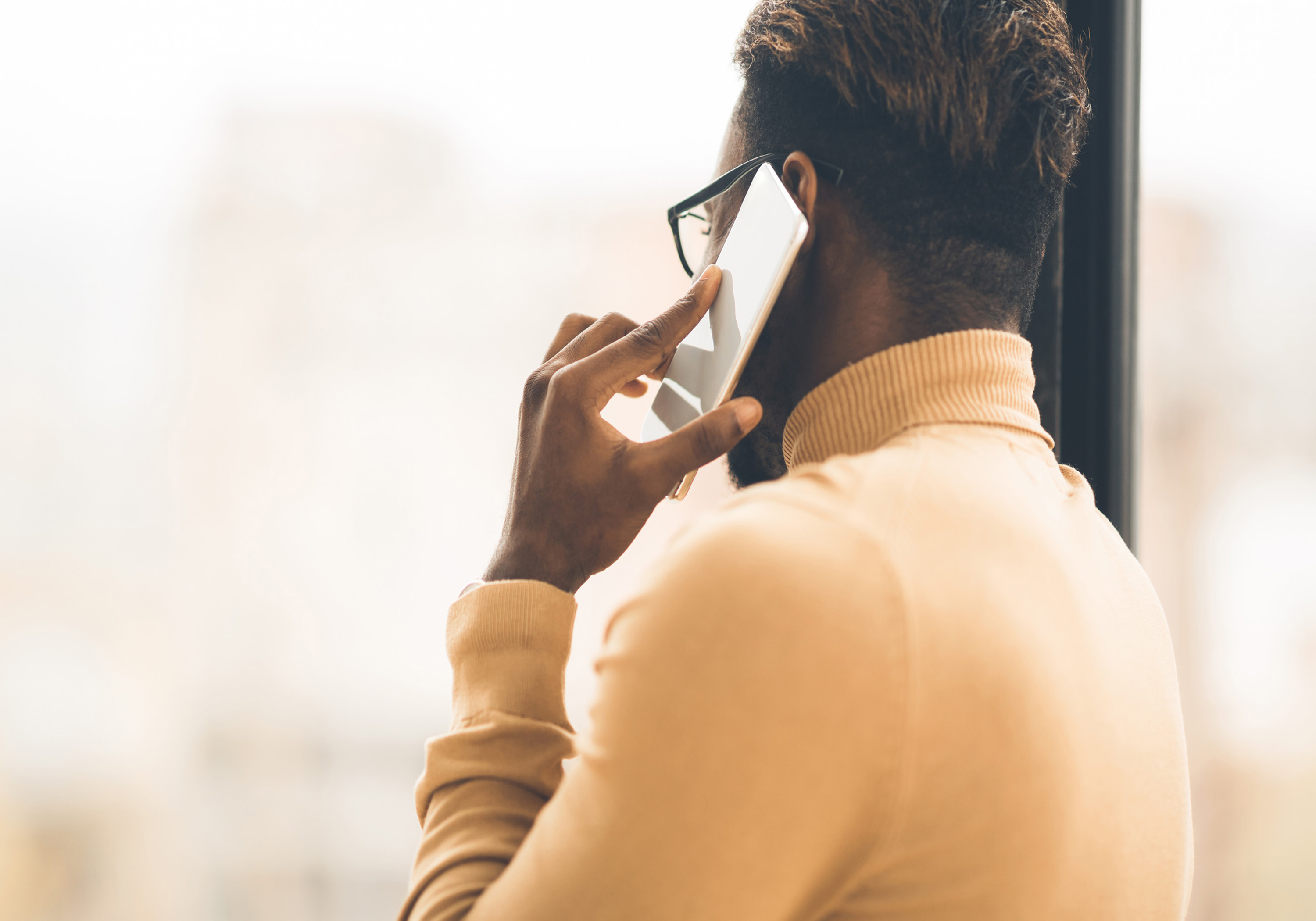 back of person on smart phone