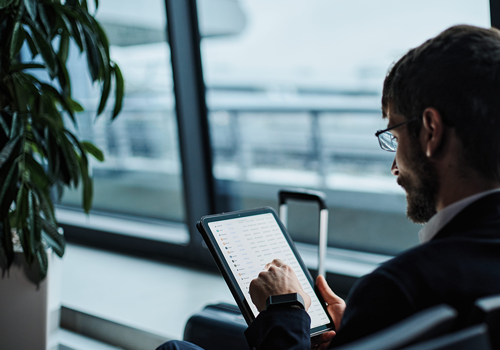 person in suit-airport-smart tablet_crop